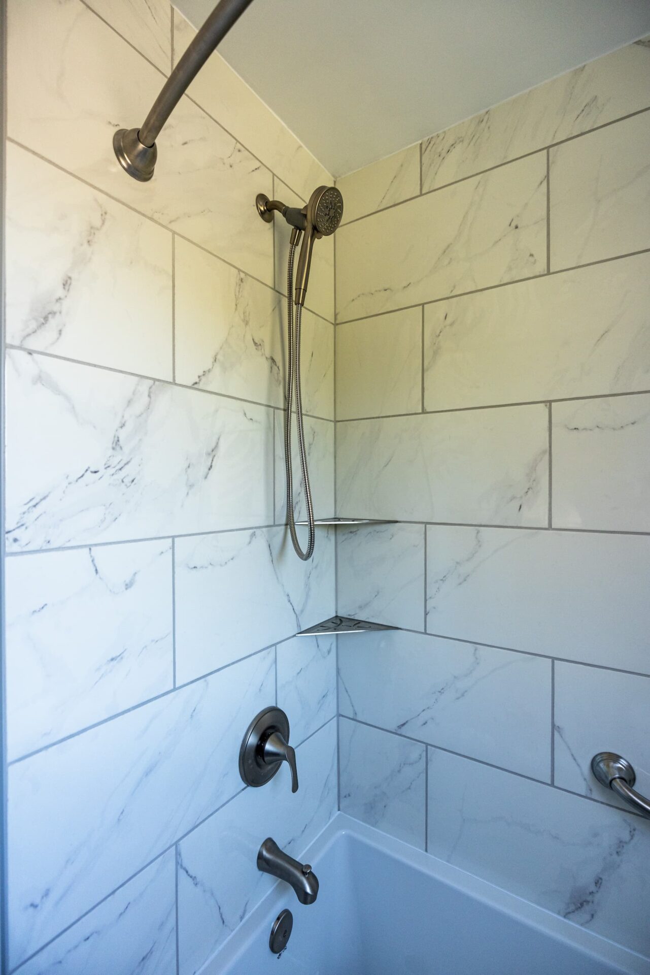compact shower stalls with marble subway shower tiles
