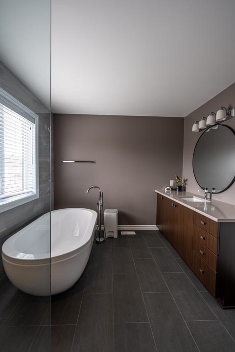 brown vanity with clean modern bathroom renovation