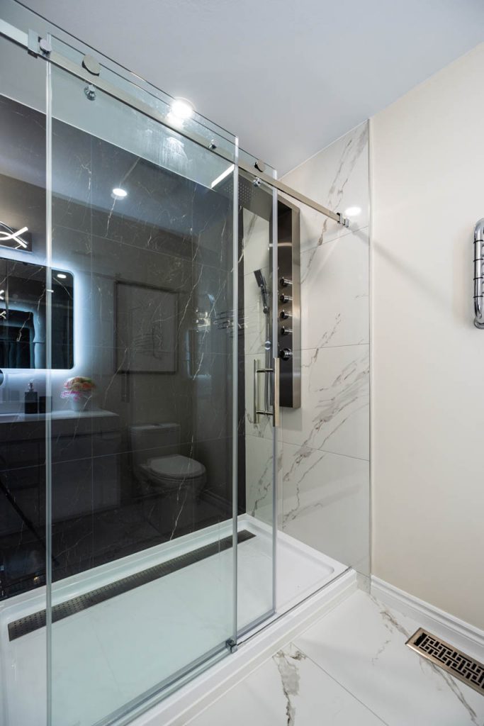 bathroom slider door with large floor tiles