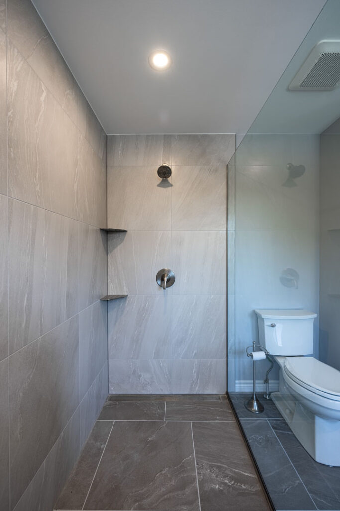 walk in shower with large tiles