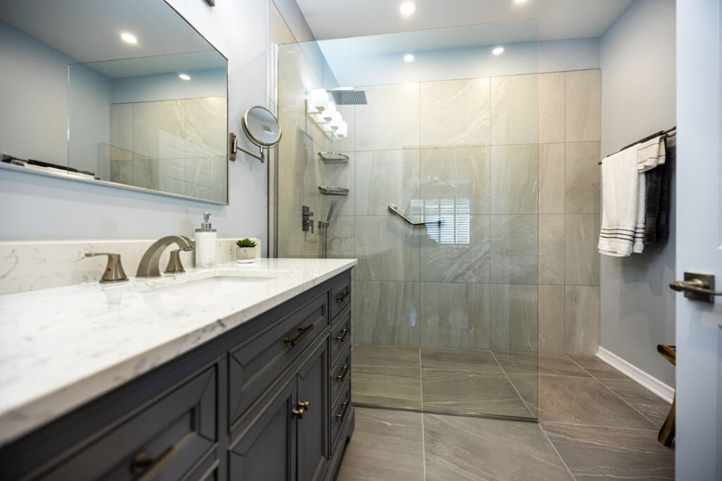 bathroom reno with framless glass shower enclosure