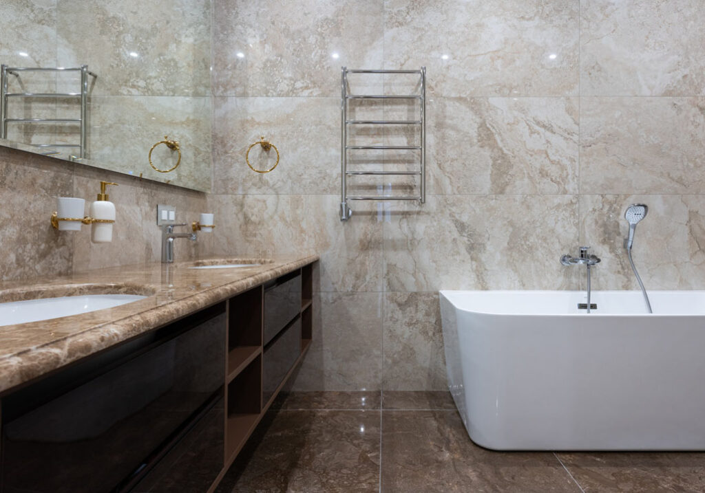 Quartz bathroom countertop with ceramic vanity and bath tub