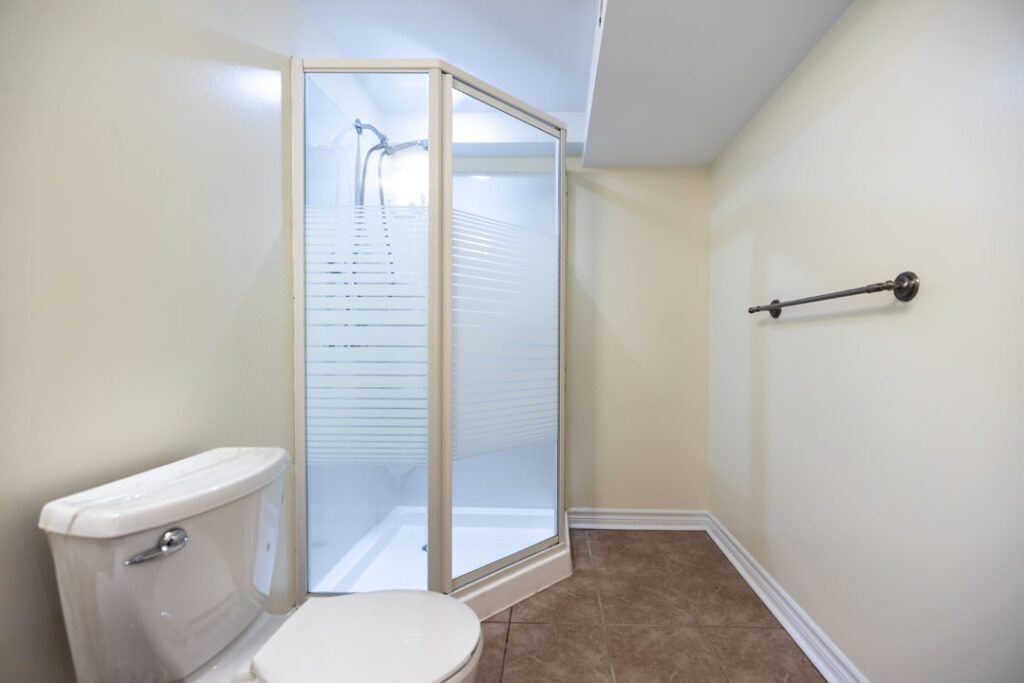 toilet and separate shower room with lightning
